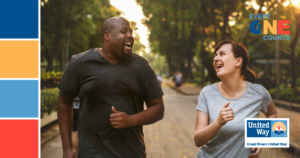 Man and woman jogging together outside.