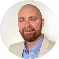Headshot of Board Member Travis Suhr
